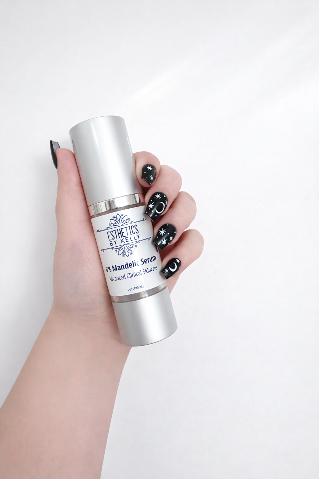 Hand holding a skincare serum bottle